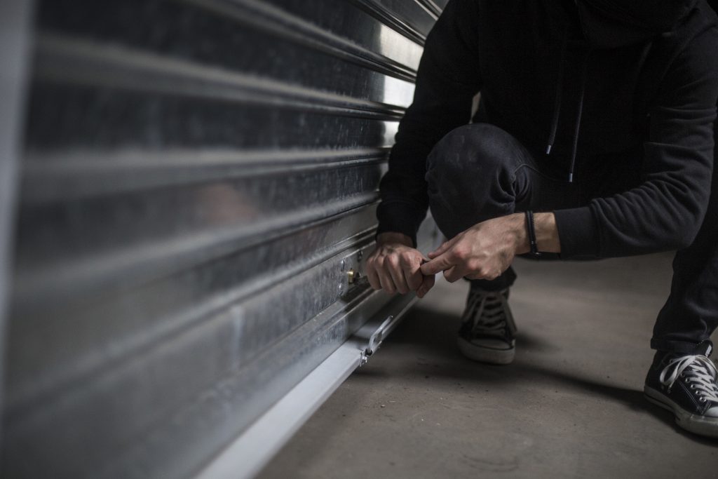 Garage door being inspected and repaired